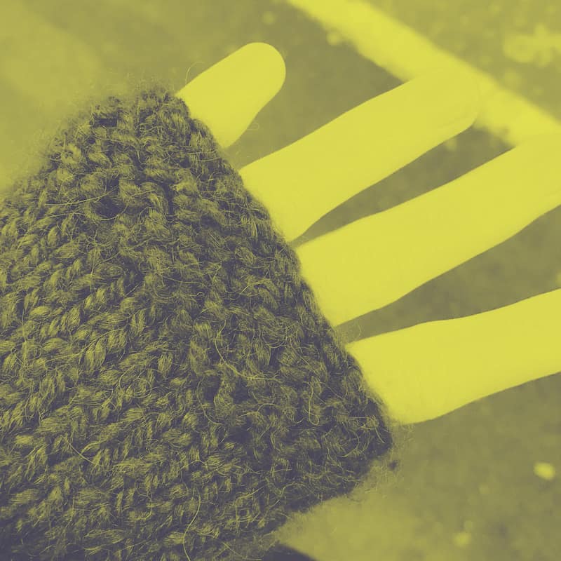 the-human-touch a hand in a mitten