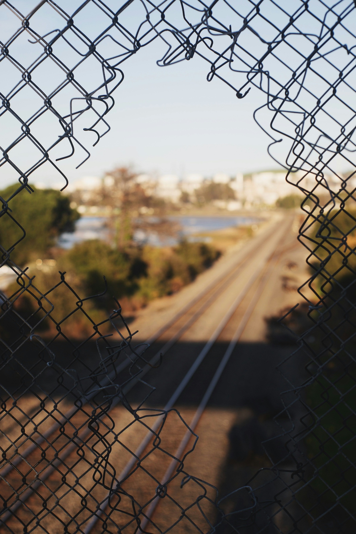 An opening in a chainlinked fence.